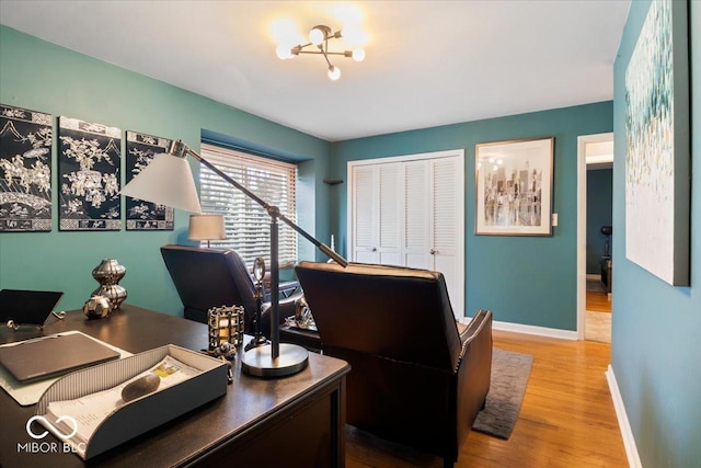 office with baseboards and wood finished floors