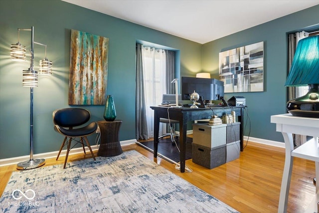 office space featuring wood finished floors and baseboards