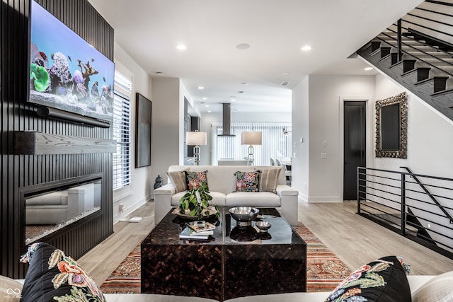 living room with light hardwood / wood-style flooring