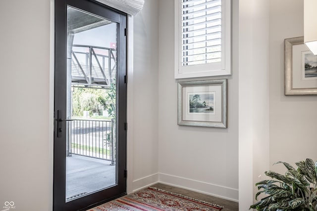 456 Monon Way Dr, Carmel, IN 46032 - doorway to outside with baseboards, wood finished floors, and a wealth of natural light