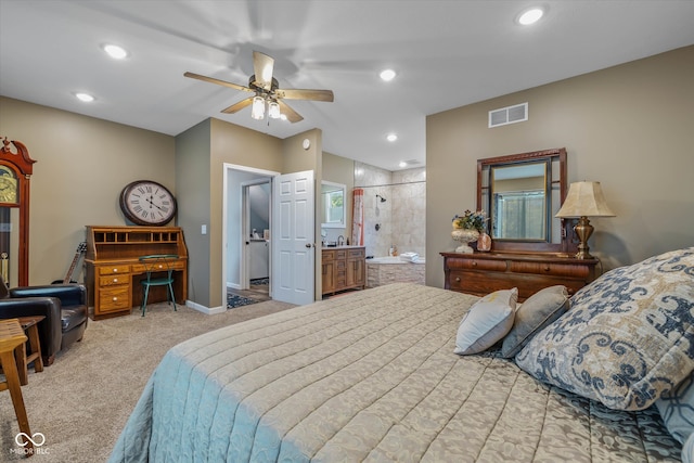 carpeted bedroom with connected bathroom and ceiling fan