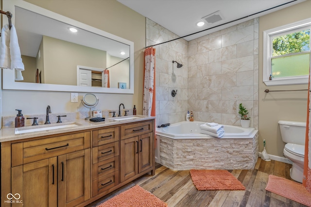 full bathroom featuring vanity, separate shower and tub, wood-type flooring, and toilet