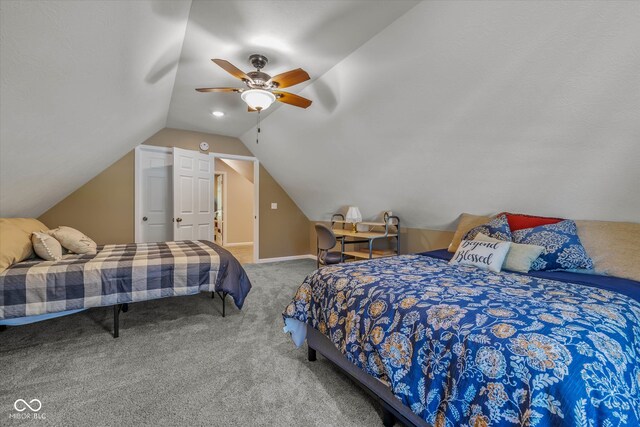 bedroom featuring ceiling fan, carpet flooring, and lofted ceiling