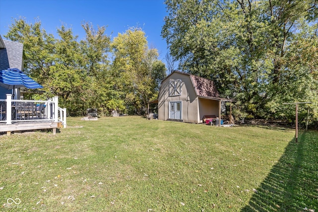 view of yard with a deck and a shed