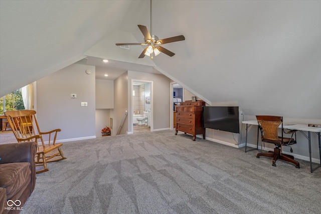 interior space with carpet floors, ceiling fan, and vaulted ceiling