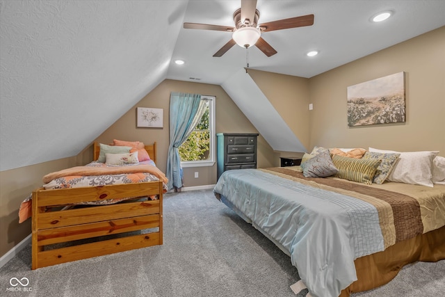 bedroom with vaulted ceiling, carpet flooring, and ceiling fan