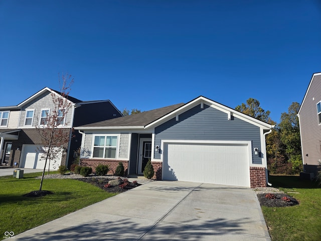 view of front facade with a front yard and a garage