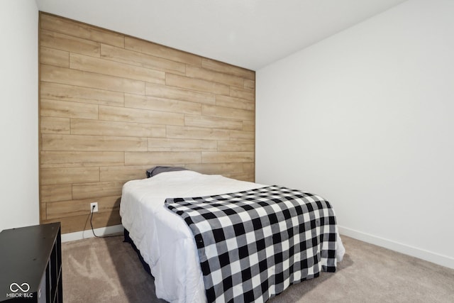 10008 Sundley Dr, Indianapolis, IN 46239 - carpeted bedroom featuring baseboards, wooden walls, and an accent wall