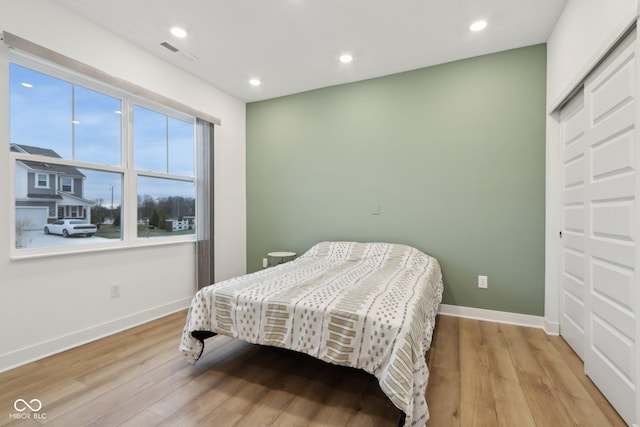 10008 Sundley Dr, Indianapolis, IN 46239 - bedroom featuring baseboards, recessed lighting, visible vents, and light wood-style floors