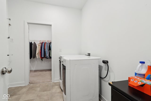 10008 Sundley Dr, Indianapolis, IN 46239 - laundry room featuring baseboards, independent washer and dryer, laundry area, and light tile patterned floors