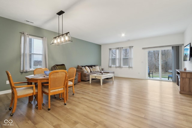 10008 Sundley Dr, Indianapolis, IN 46239 - dining room featuring light wood-type flooring, baseboards, and visible vents