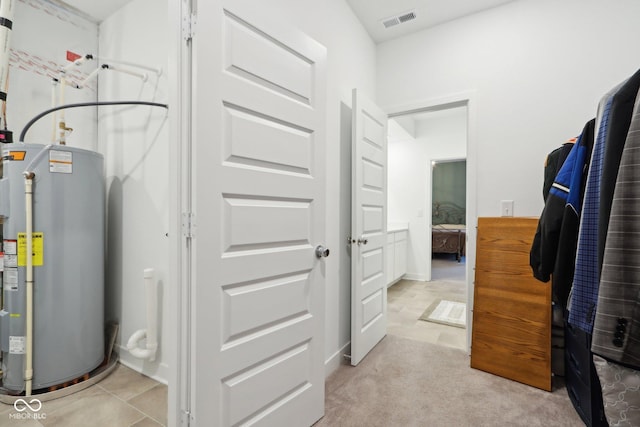 10008 Sundley Dr, Indianapolis, IN 46239 - utilities with water heater and visible vents