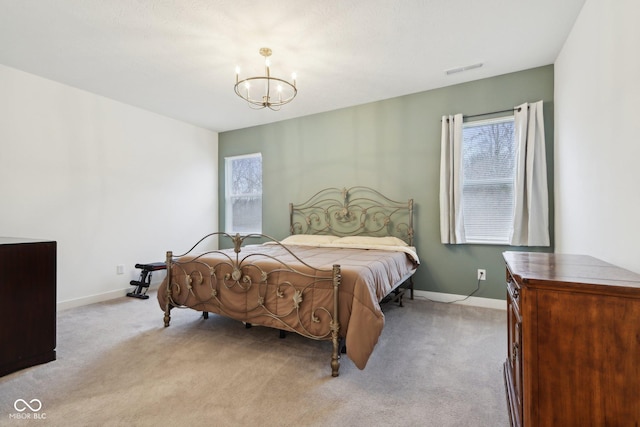 10008 Sundley Dr, Indianapolis, IN 46239 - carpeted bedroom with a notable chandelier, baseboards, and visible vents