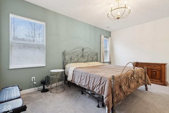 10008 Sundley Dr, Indianapolis, IN 46239 - carpeted bedroom featuring a notable chandelier