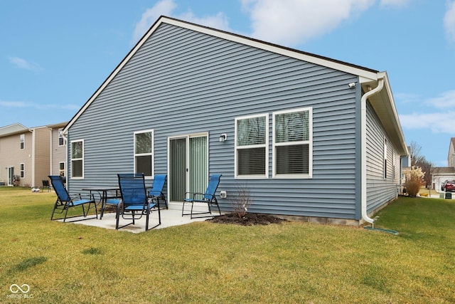 10008 Sundley Dr, Indianapolis, IN 46239 - rear view of property with a lawn and a patio area