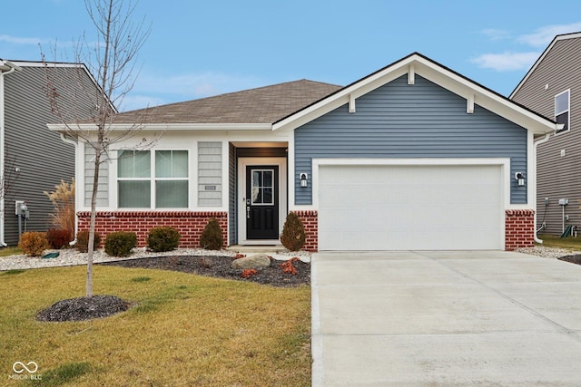 10008 Sundley Dr, Indianapolis, IN 46239 - ranch-style home with brick siding, concrete driveway, and an attached garage