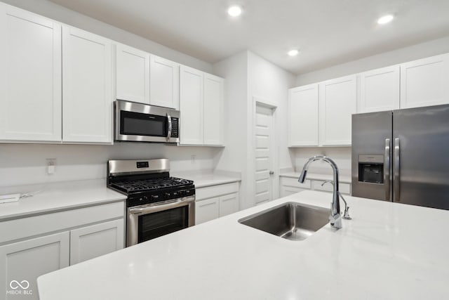 10008 Sundley Dr, Indianapolis, IN 46239 - kitchen featuring white cabinetry, light countertops, recessed lighting, stainless steel appliances, and a sink