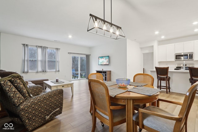 10008 Sundley Dr, Indianapolis, IN 46239 - dining space with light wood-style floors and recessed lighting