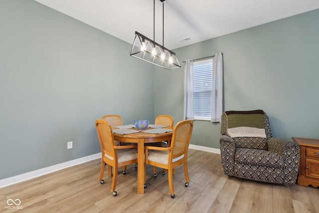 10008 Sundley Dr, Indianapolis, IN 46239 - dining room featuring baseboards and light wood-style flooring
