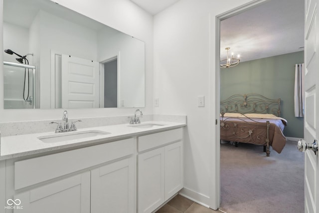 10008 Sundley Dr, Indianapolis, IN 46239 - ensuite bathroom with double vanity, a sink, baseboards, and ensuite bathroom
