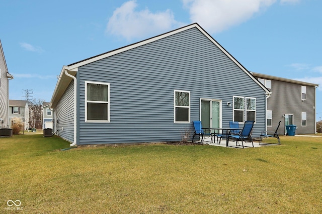 10008 Sundley Dr, Indianapolis, IN 46239 - rear view of property featuring a patio, central AC, and a yard