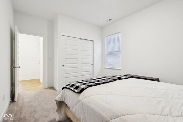 10008 Sundley Dr, Indianapolis, IN 46239 - carpeted bedroom featuring baseboards, visible vents, and a closet