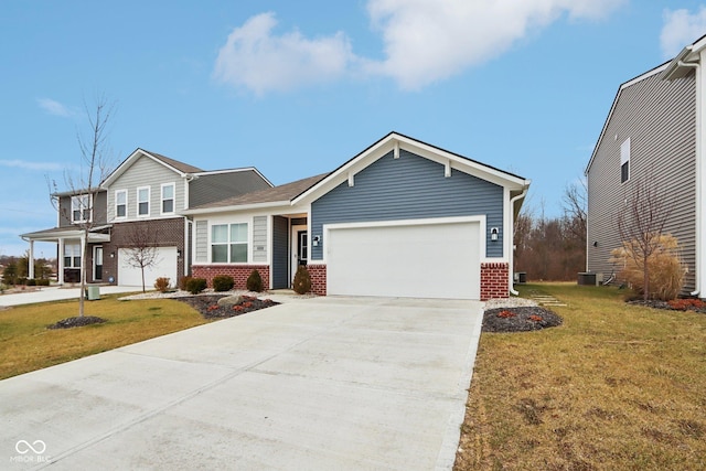 10008 Sundley Dr, Indianapolis, IN 46239 - view of front facade featuring brick siding, a front yard, driveway, and an attached garage