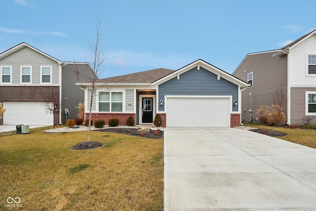 10008 Sundley Dr, Indianapolis, IN 46239 - view of front of house featuring driveway, a front yard, a garage, and brick siding