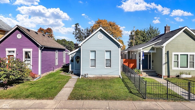 bungalow-style house with a front yard