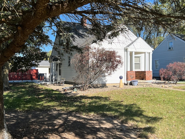 view of property exterior with a lawn