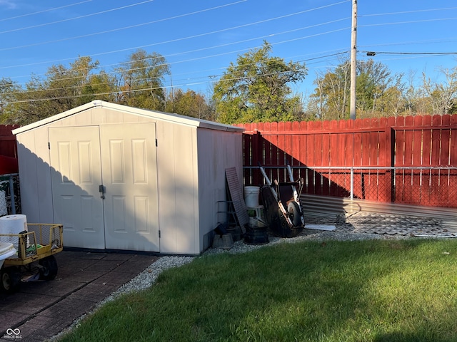 view of outdoor structure with a lawn