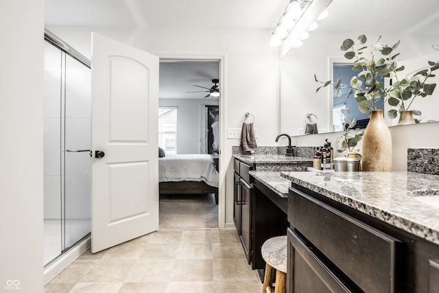 bathroom featuring vanity, plenty of natural light, ceiling fan, and an enclosed shower