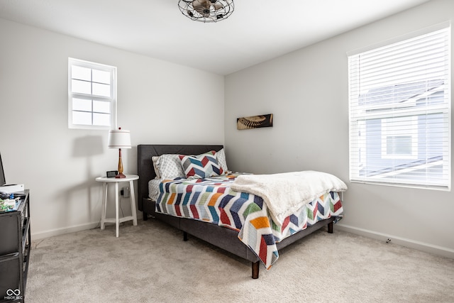 bedroom featuring light colored carpet