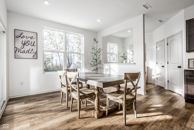 dining area with hardwood / wood-style flooring