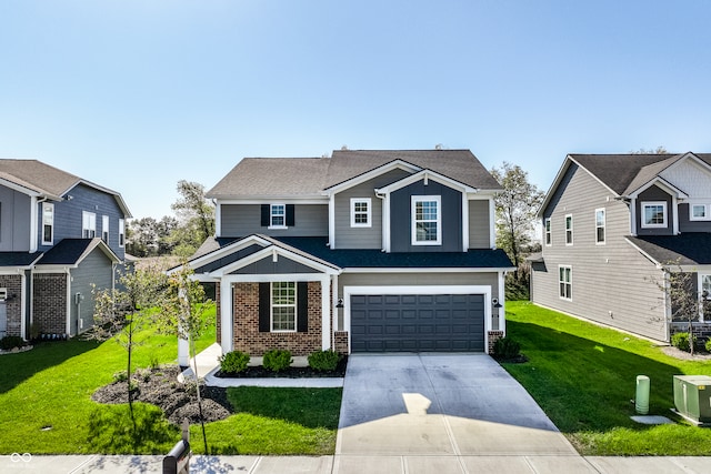 view of front of home featuring a front yard and a garage