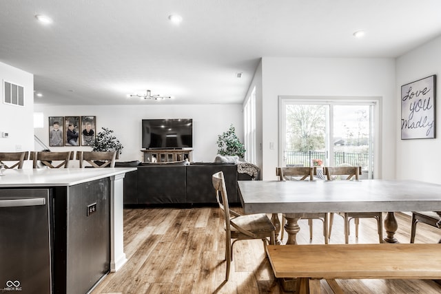 dining space with light hardwood / wood-style floors