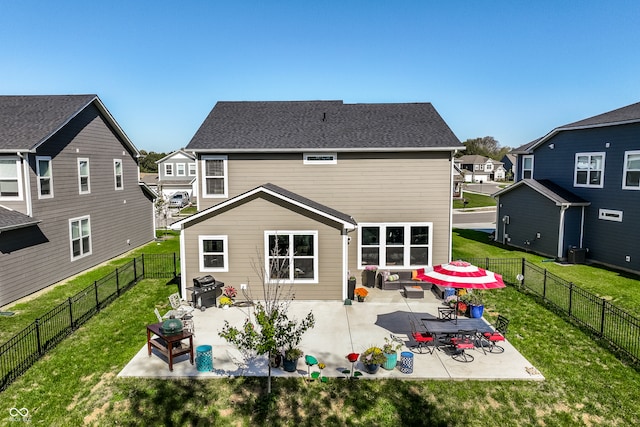 rear view of property featuring a patio, a lawn, and cooling unit