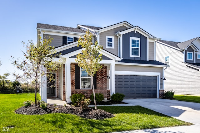 view of front of house with a front yard and a garage