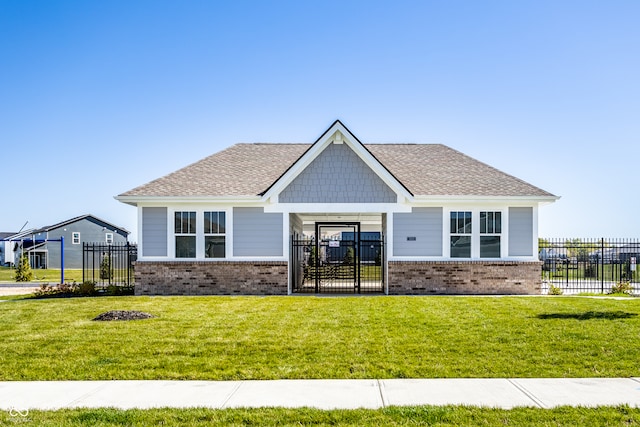 rear view of property with a yard