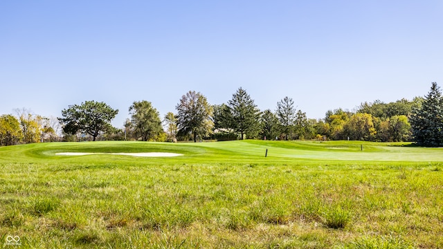 view of home's community featuring a lawn