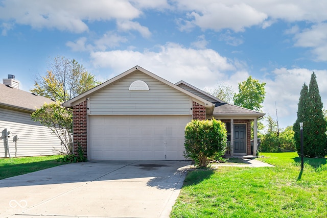 view of front of property with a garage and a front lawn