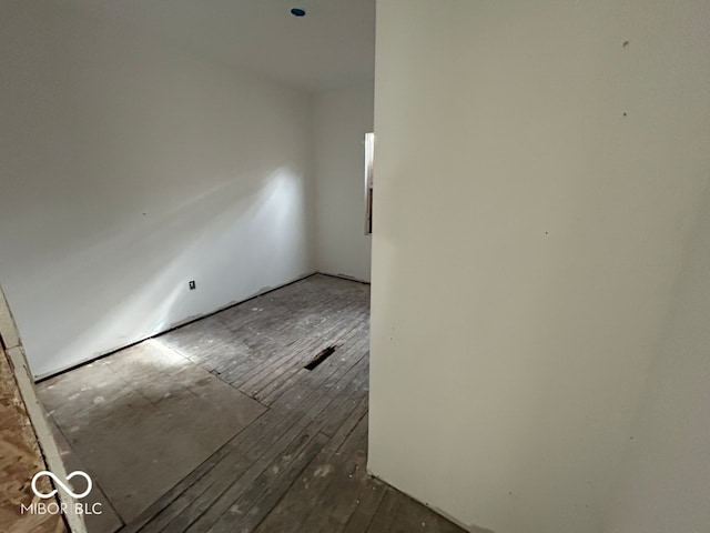 unfurnished room featuring dark hardwood / wood-style floors