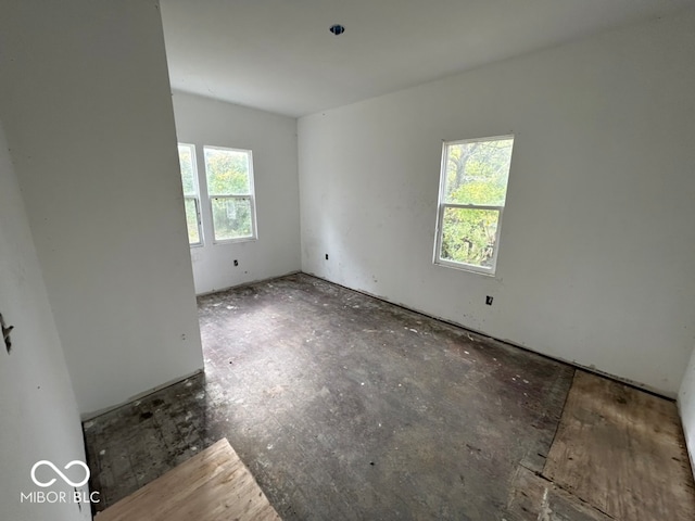 unfurnished room featuring a healthy amount of sunlight