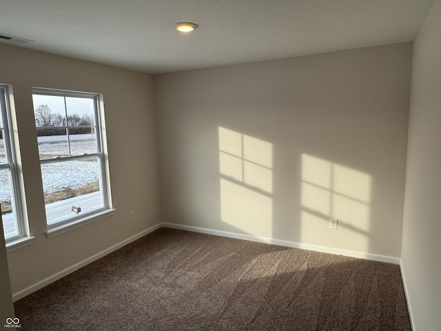 view of carpeted spare room