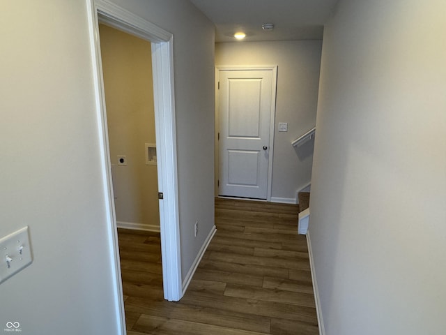 hallway with dark wood-type flooring