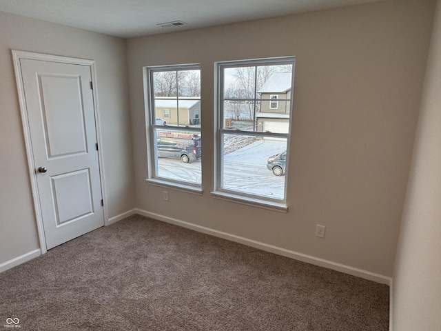 spare room featuring carpet