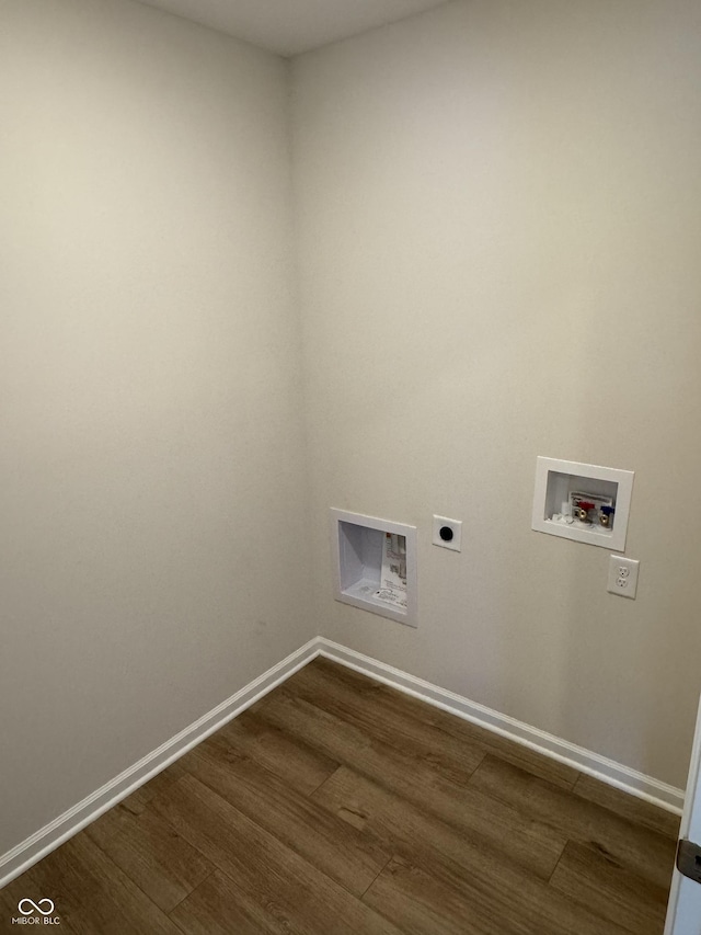 laundry area with hookup for a washing machine, dark hardwood / wood-style floors, and hookup for an electric dryer