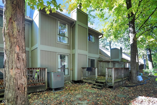 back of property featuring a wooden deck and central AC unit