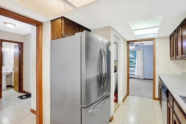 kitchen with ceiling fan, appliances with stainless steel finishes, and light tile patterned floors