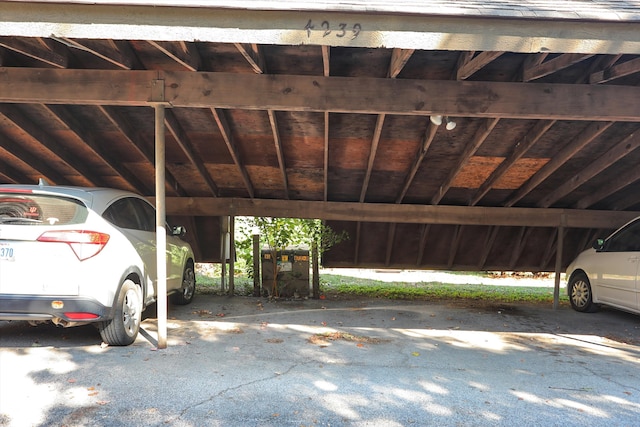 garage featuring a carport